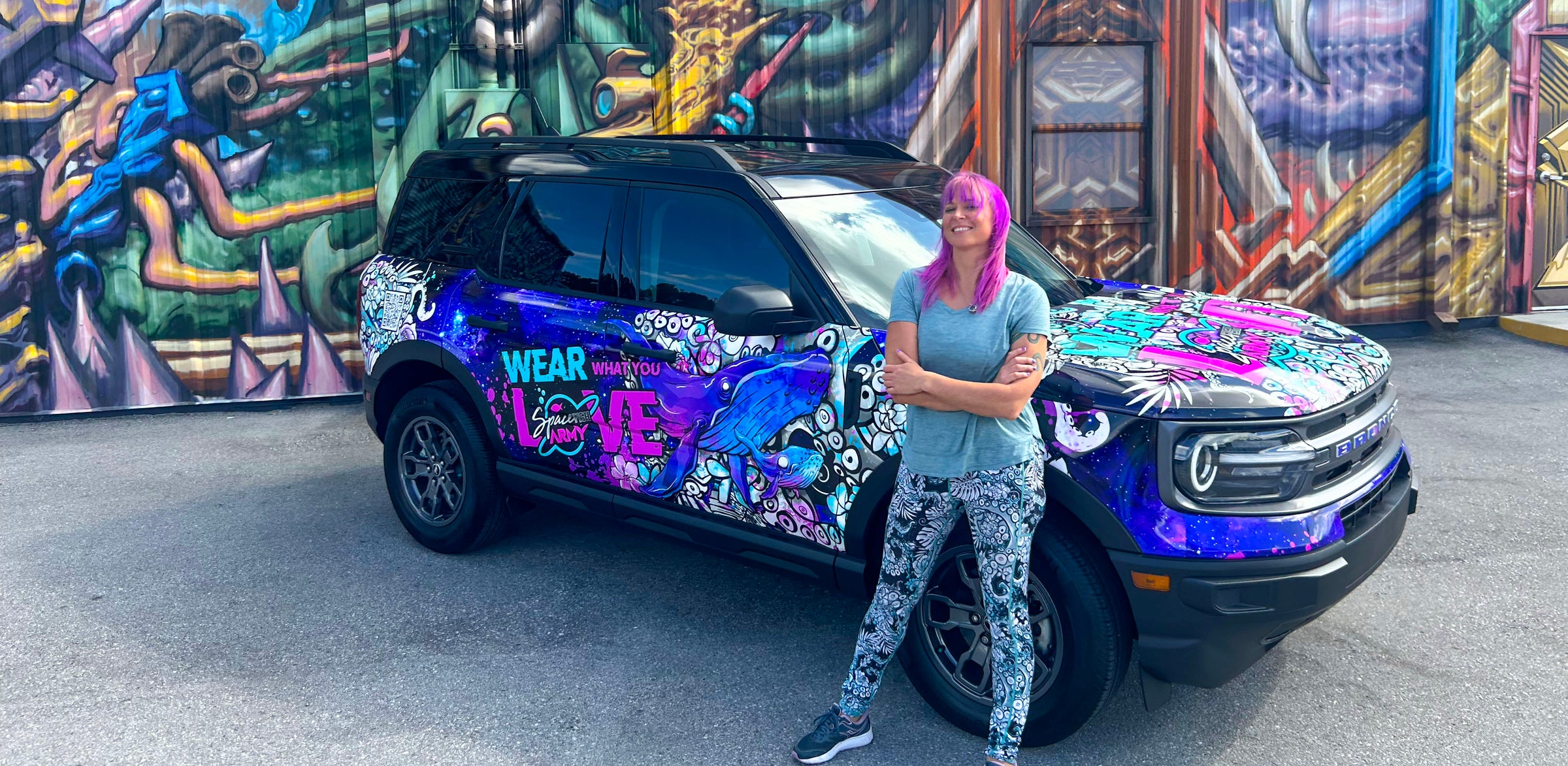 Girl with a car showing Spacefish Army prints